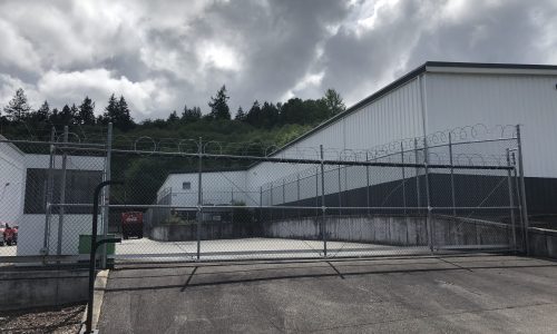 Back of Warehouse View through Fence