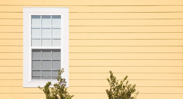 yellow siding on home exterior