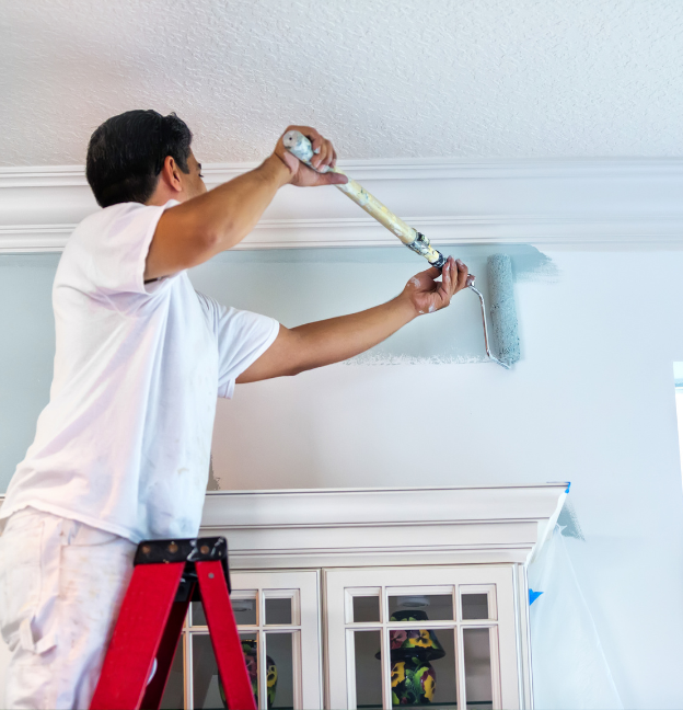 painter painting a interior room