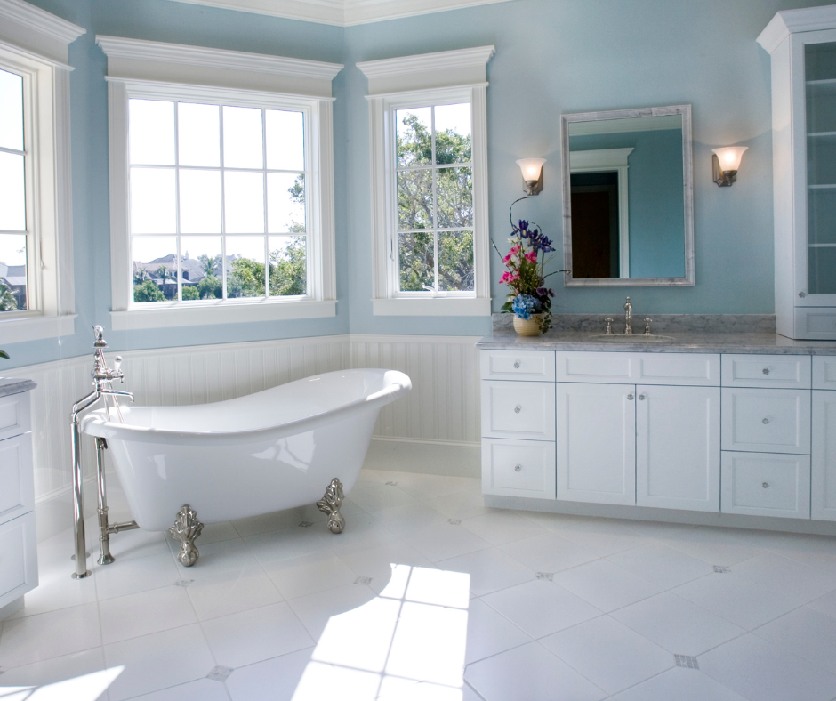 blue bathroom with white cabinets