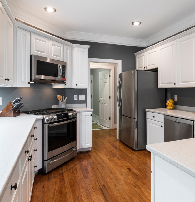 white kitchen cabinets in modest home